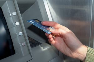 Hand using ATM